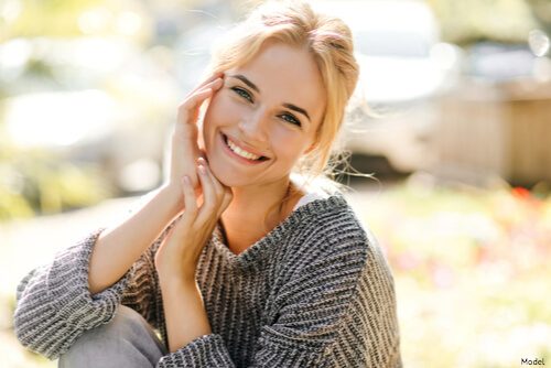 Woman rest her head on her hands